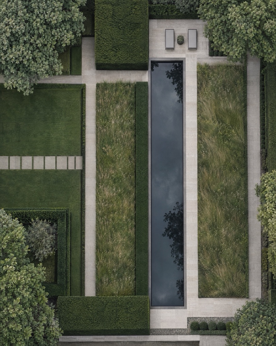 Overhead view of a contemporary garden reading as geometry: clipped yew, a dark reflecting pool and bands of meadow grass.